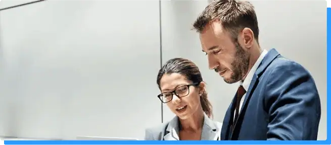 Innovative business professionals collaborating in a modern office environment, emphasizing digital transformation and technology solutions offered by Rivell.