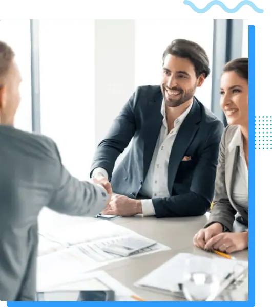 Professional business handshake between colleagues in a modern office environment.