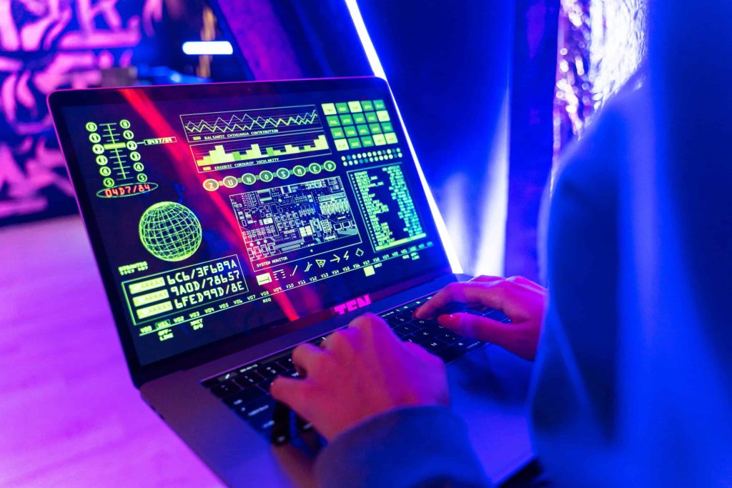 AI-generated tech interface on laptop screen showcasing futuristic digital data visualization and cybersecurity concepts in a neon-lit environment.