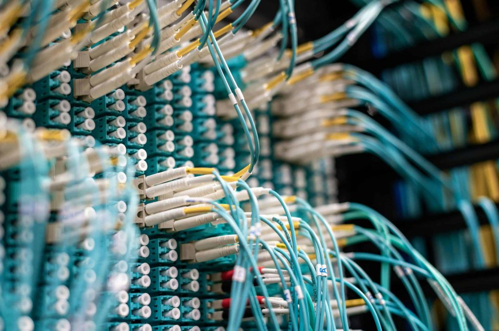Fiber optic cables connected to networking equipment.