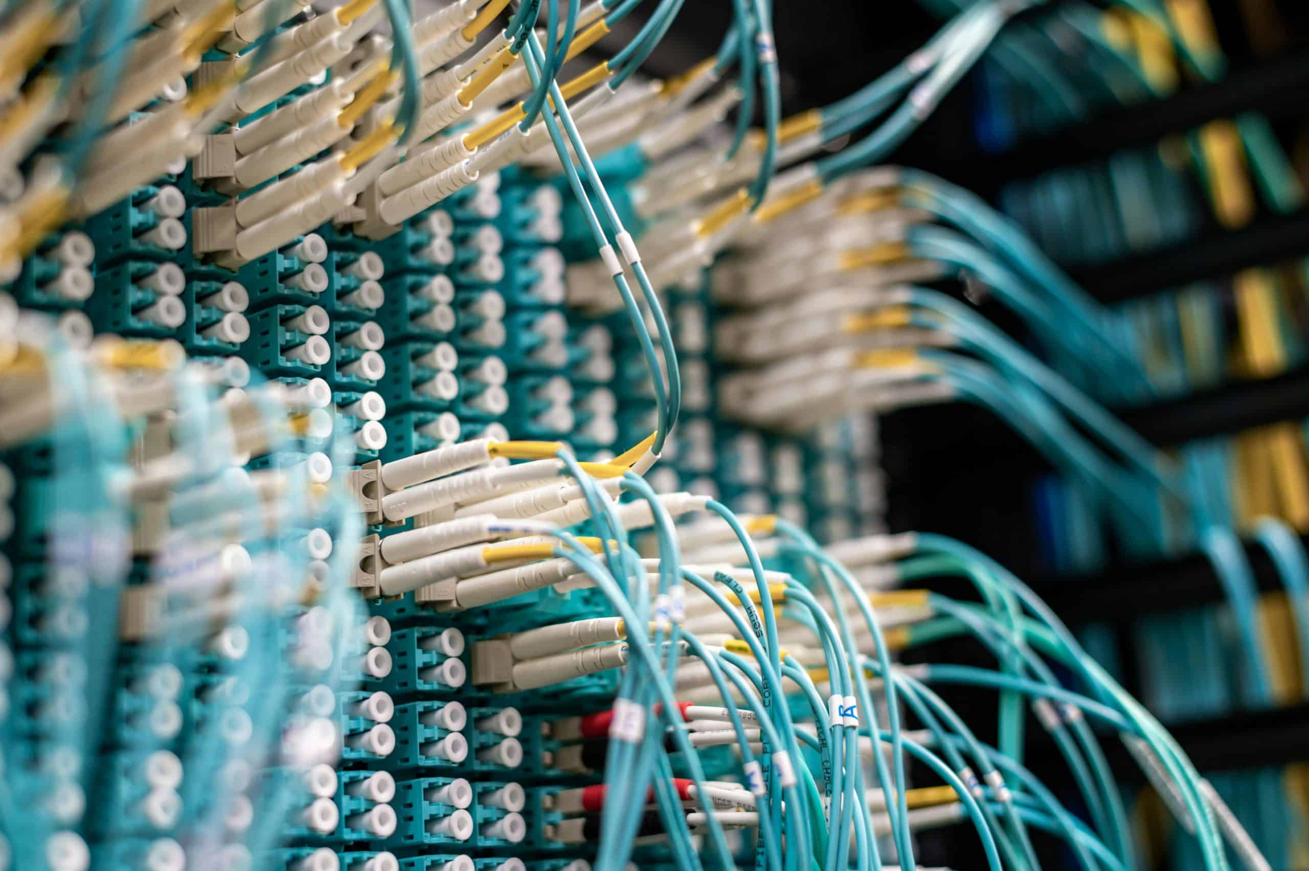 Fiber optic cables connected to networking equipment.