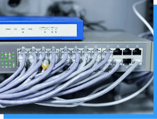 Blue network switch with multiple Ethernet cables connected, showcasing reliable managed networking hardware.