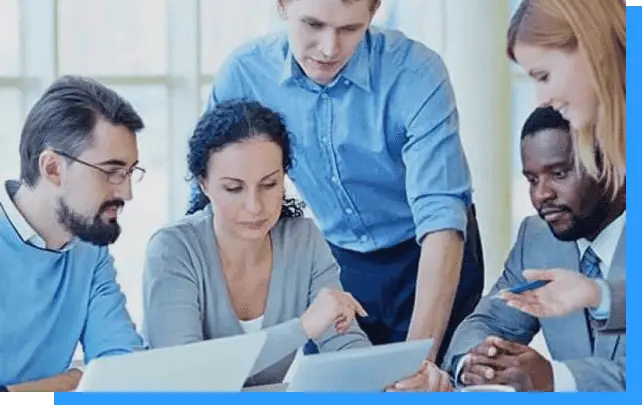 Team collaboration in a modern office setting with diverse professionals discussing business strategies.