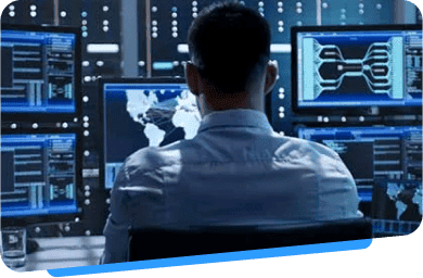 Man monitoring network activity on a computer screen.